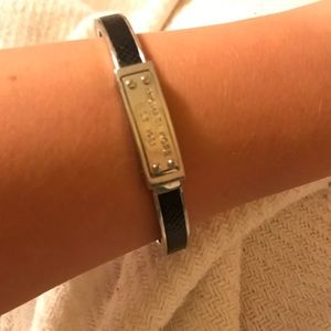 Michael Kors snap bangle in black and silver